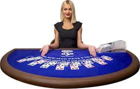 Dealer reveal and settlement Dealer revealing their hole card at end of round